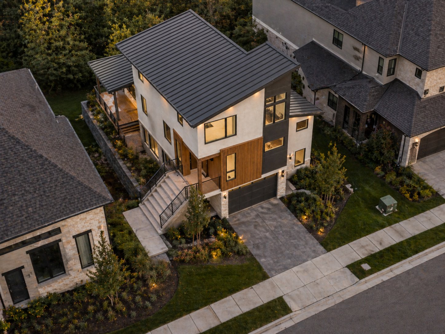 Aerial view of modern contemporary custom home and landscaping in The Woodlands