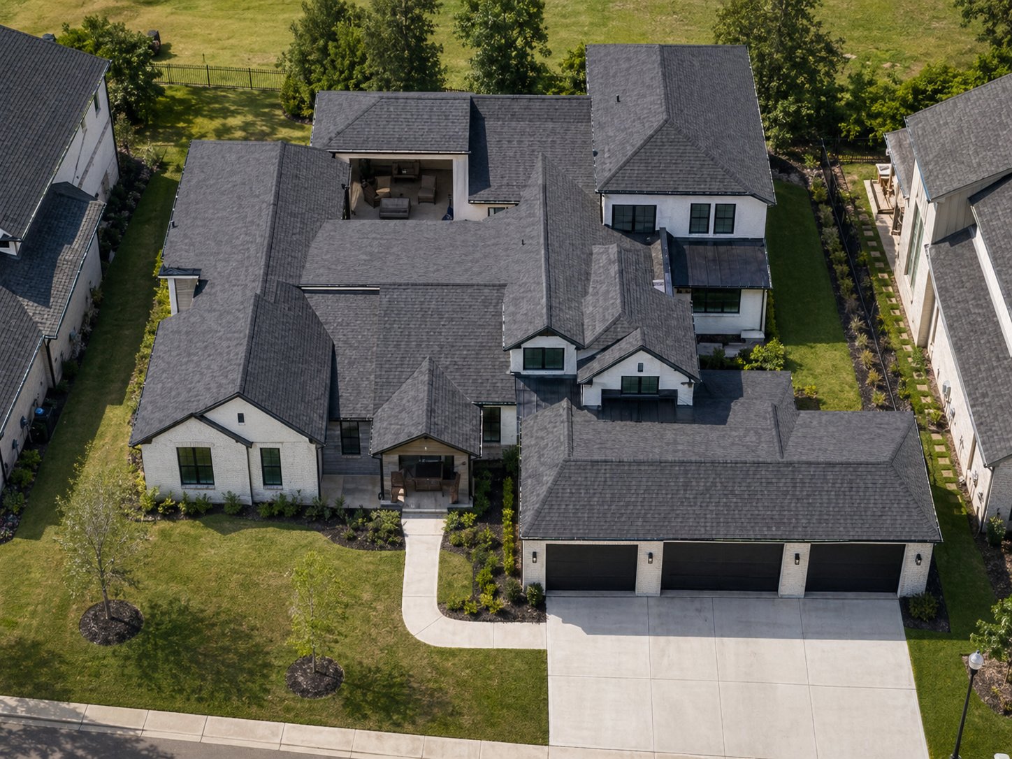 Aerial view of modern white brick custom home in League City TX