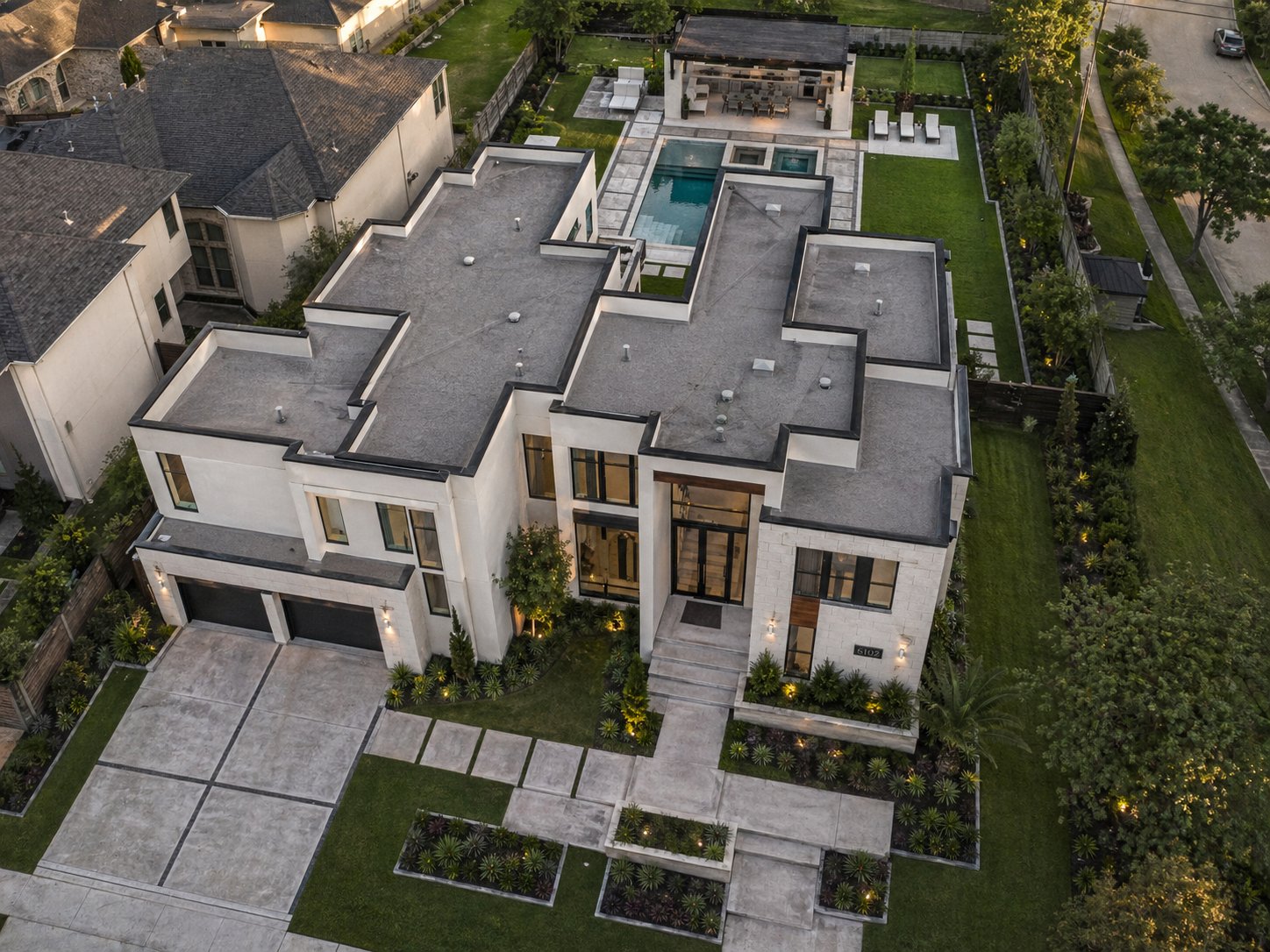 Aerial view of ultra-modern Houston custom home with pool